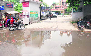 Posing problems for patients and their attendents, sewage gets stagnant outside the Civil Hospital due to blockage in sewerage pipes in Amritsar on Sunday