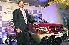 General Motors India President and Managing Director Lowell Paddock poses with Chevrolet Tavera