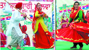 Participants perform to Punjabi songs during a function hosted in the city to celebrate the festival of Teej on Sunday. Apart from dance performances, the function also had a mehndi (henna) applying competition, an exhibition of copper utensils, swings and rides to entertain the visitors.