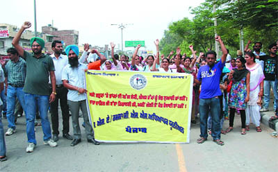 Members of the SSA-RMSA teachers union stage protest in Bathinda on Sunday. They were demanding hike in pay scale and regularisation of jobs. The union disapproved of the delay by the government in considering their case