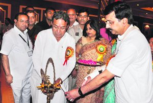 Haryana Health Minister Rao Narendra Singh (right) lights a lamp during the 32nd convention organised by the Haryana Civil Medical Service Association in Karnal on Sunday.