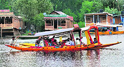 Tourists enjoy shikara rides on the Dal Lake in Srinagar on Sunday
