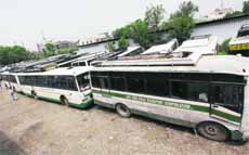 State Road Transport Corporation buses parked in a yard as the strike by employees continues in Jammu.