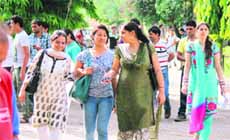 Aspirants emerge from Government College for Women, Gandhi Nagar, after taking the J&K Civil Services Entrance Examination in Jammu on Sunday. 