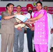 Amrit Malhotra, chairman, J&K Legislative Council gives awards to the winners of the 14th SOF National Science Olympiad in Jammu.