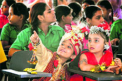 Students of Senior Secondary Public School await their turn during a fancy dress competition in Ludhiana