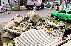 Debris lying strewn along roads near Society Cinema