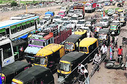 Vehicles stuck in a traffic jam following a protest by teachers on the Jalandhar bypass on Sunday