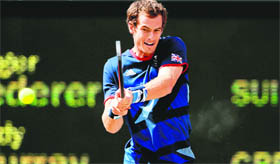 Britains Andy Murray beats Roger Federer 6-2, 6-1, 6-4 in gold medal match.