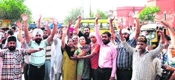 Supporters hold a protest outside Gate Hakima police station in Amritsar on Monday.