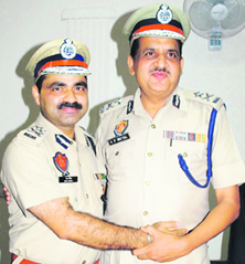 Ram Singh, IG Border Range, takes over charge from outgoing Police Commissioner RP Mittal in Amritsar on Monday.