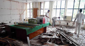 Workers remove the termite-infested wooden material at the Muktsar Deputy Commissioner's office.