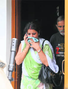 Fizas sister and uncle come out of her house at Sector 48-C in Mohali.
