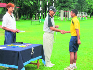 Col PK Kumaria, Commandant of the RIMC, gives away a prize to the winner of the cross-country inter-section competition in Dehradun on Monday.