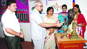 YP Goswami, controller of examination, Kurukshetra University, lights the ceremonial lamp at the inaugural function of JCD Memorial College, Sirsa.