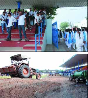 Male students (above) line up at the stairs as the female students make their way out of the stadium. Construction of a track (below) at the stadium is underway. The tanker, the only source of water for the students, is also seen in the picture. 