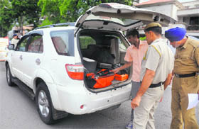Police personnel check a vehicle during a drive ahead of the Independence Day in Chandigarh on Tuesday.