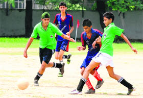 Players in action during a football match between St Kabir and St Anees School at Sector 37 in Chandigarh on Tuesday.