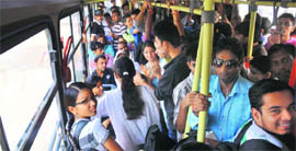 Schoolchildren and other passengers travel in an overcrowded CTU bus from ISBT-43 in Chandigarh on Tuesday.