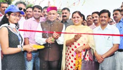 Chief Minister PK Dhumal inaugurates a synthetic track at Hamirpur on Tuesday. A Tribune photograph 
