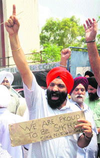 Members of the All J&K Sikh Organisation protest against the shootout in a gurdwara in the USA, in Jammu on Tuesday.