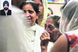 Relatives of Rajanpartap grieve over his death in Model Town Extension, Ludhiana, on Tuesday. tribune photo: himanshu mahajan