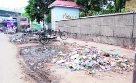 Garbage lies scattered outside the main gate of the Civil Hospital (left) and inside the complex of Guru Nanak Dev Hospital in Amritsar