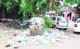 Garbage lies scattered outside the main gate of the Civil Hospital (left) and inside the complex of Guru Nanak Dev Hospital in Amritsar