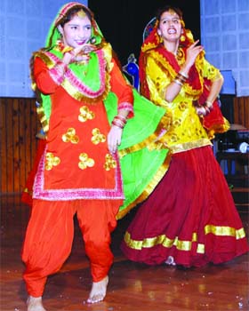 Students of Sri Guru Harkrishan Senior Secondary Public School perfom giddha during Teej celebrations in Amritsar on Wednesday