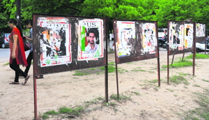 The display boards with torn posters of different organisation near the Arts block at Panjab University in Chandigarh on Wednesday.