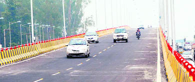 Commuters use the bridge on the Jalandhar-Amritsar track after its inauguration in Amritsar on Wednesday.