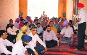 Teachers of SCD Government College, Ludhiana, take part in a state-wide protest in Ludhiana on Wednesday. 