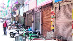 Shops in Shastri market lie shut in protest against the killing of a businessman Munish Khanna by robbers in Amritsar on Thursday. photo: sameer sehgal
