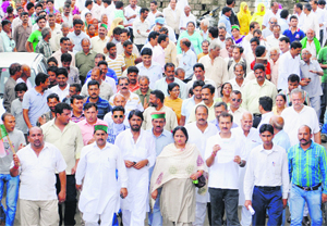 Congress supporters protest against the state government in Dharamsala on Thursday.