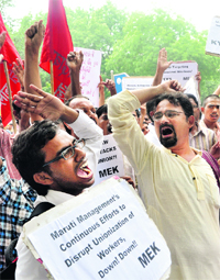 Trade union activists protest against inhuman treatment of workers at Maruti Suzukis Manesar plant outside Shram Shakti Bhawan in New Delhi on Thursday.