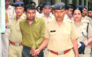 Former general secretary of Karnals Apna Ghar Manav Dass being produced in a court in Karnal on Thursday.