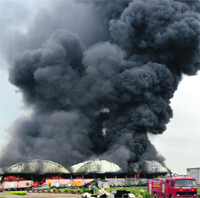 Smoke billows out of a hazardous waste plant in Faridabad after a fire on Thursday. 