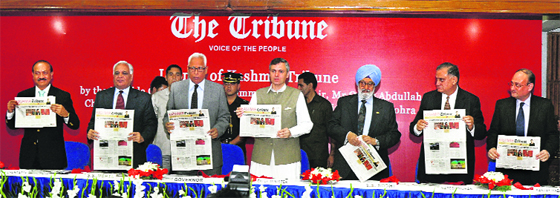 J&K Chief Minister Omar Abdullah (4th from left) launches Kashmir Tribune at a function in Srinagar on Thursday. Others on the dais are (L-R) The Tribune Editor-in-Chief Raj Chengappa, Trustee Lt Gen (retd) SS Mehta, Chief Guest and J&K Governor NN Vohra, Trust president Justice (retd) SS Sodhi, Trustee Naresh Mohan and General Manager Sanjay Hazari. Kashmir Tribune will be available in the Kashmir Valley. 