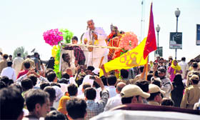 Devotees take part in a procession on the eve of Janmashtami in Srinagar.