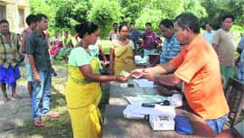 Aid being given to inmates at a relief camp of Assam riots victims in Chirang.