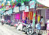 After keeping their units shut for the past two days, traders open shops at Shastri market in Amritsar on Friday
