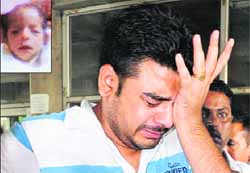 The grieving father of the baby (inset) who died at the GMCH-32, Chandigarh, allegedly due to negligence on the part of a nurse on Friday