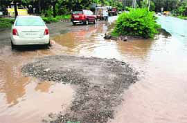 Tough time for commuters to cross a waterlogged road separating Industrial Area, Phase 1, and Sector 12-A , Panchkula. 