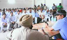 UT SSP (City) Desraj Singh (sporting black cap) during an interaction session with residents at Burail in Chandigarh on Friday. 