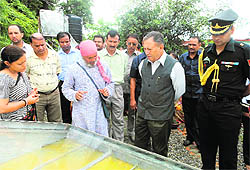 HESCO founder Anil Joshi informs Chhattisgarh Governor Shekhar Dutt about various technologies at Shuklapur village near Dehradun on Friday