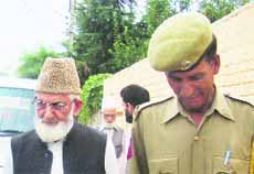 The police detains Hurriyat leader Syed Ali Geelani after he tries leaving his Hyderpora residence for offering Friday prayers in Srinagar.