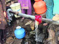 A water pipe punctured by nomads on the Patnitop-Sanasar road to draw water from it.