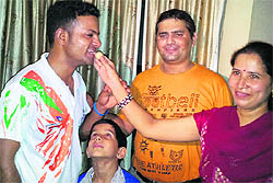 Vijay Kumar (left) with his cousin Aarti Sharma at her residence in Chander Nagar, Ludhiana, on Friday