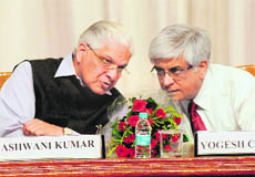 Minister of State for Science and Technology Ashwani Kumar (left) interacts with PGI Director Yogesh Chawla at the research day in Chandigarh on Saturday. 