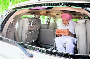 A resident shows the brick with which the windowpane was broken at Sector 71 in Mohali on Saturday. 